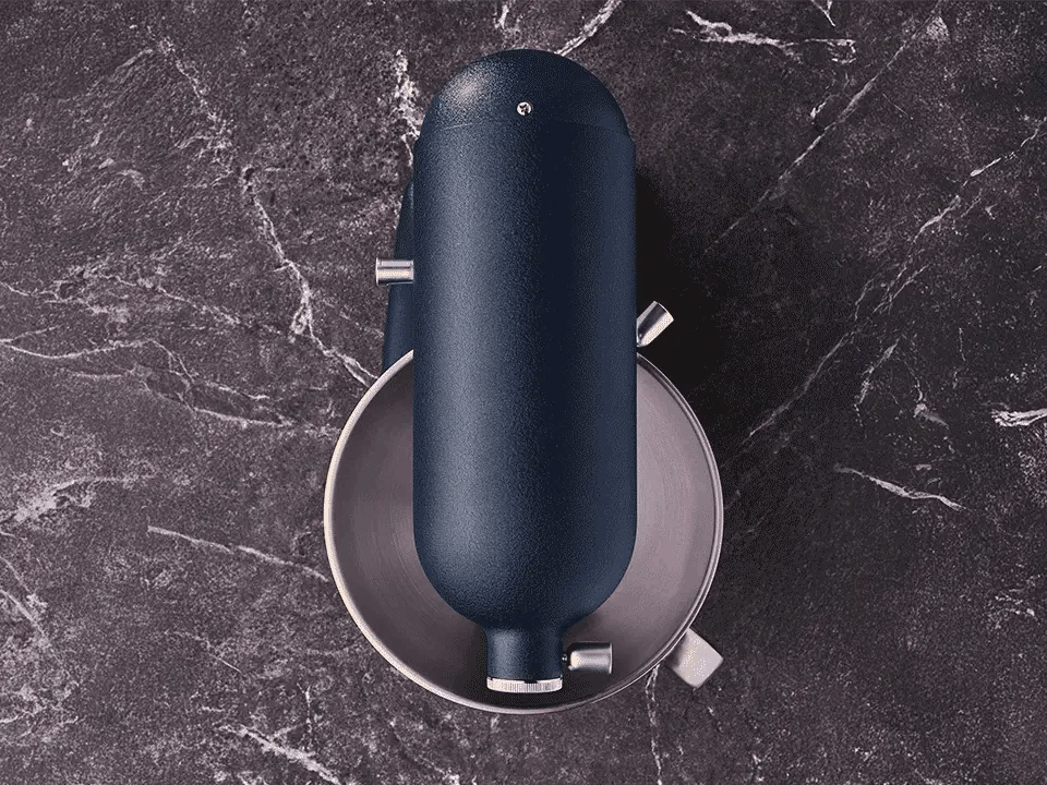 KitchenAid Artisan Plus bowl light switching on as the mixer head lowers